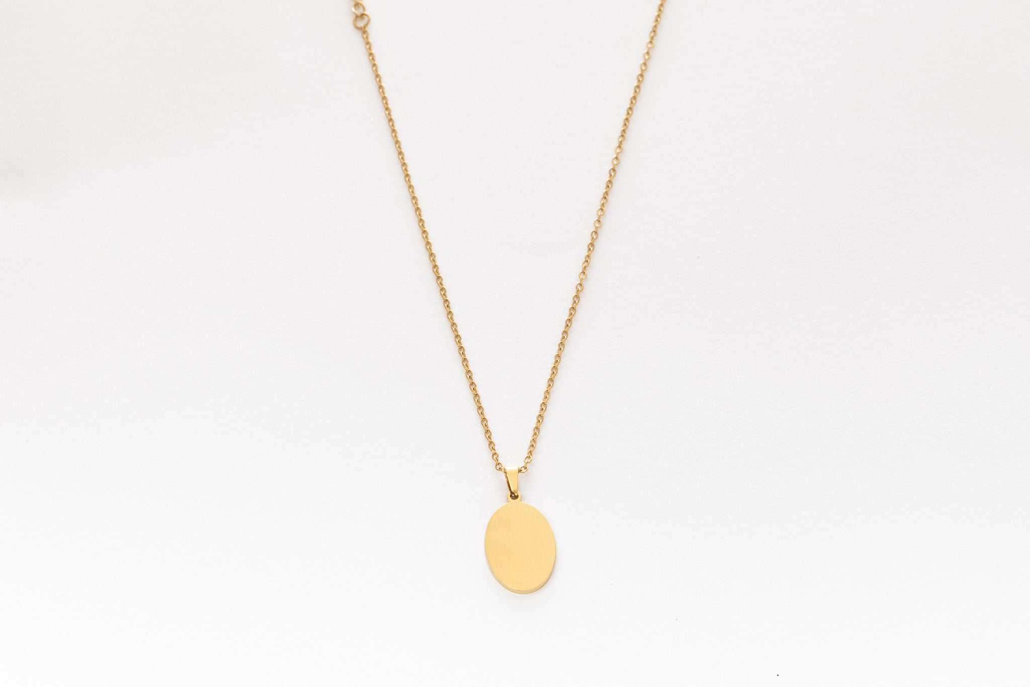 Gold oval pendant